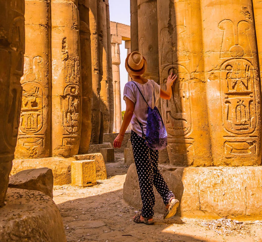 A-tourist-near-one-of-the-columns-of-Karnak-Temple