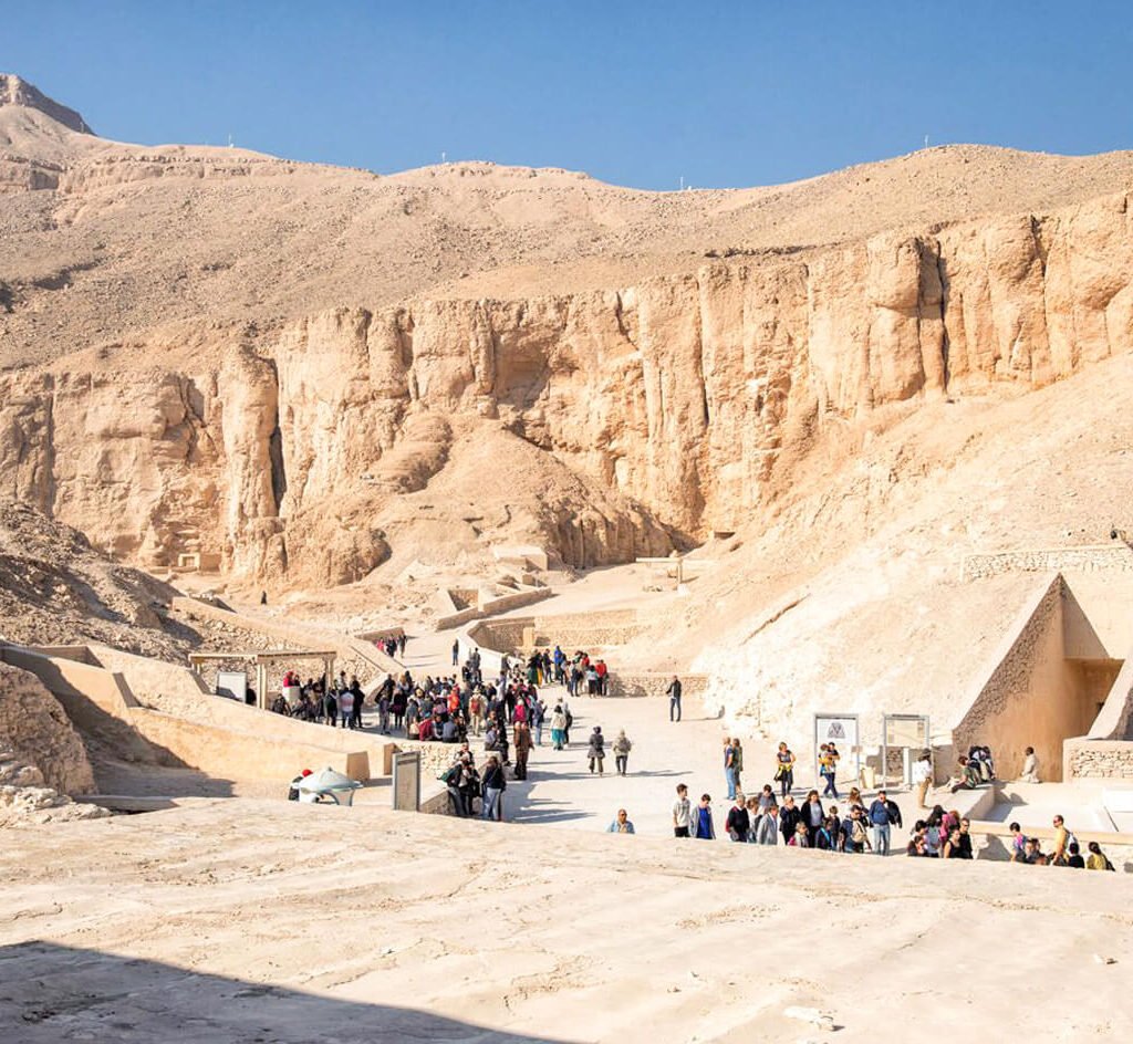 A-wonderful-shot-of-a-group-of-tourists-in-front-of-the-Valley-of-the-Kings-in-Luxor
