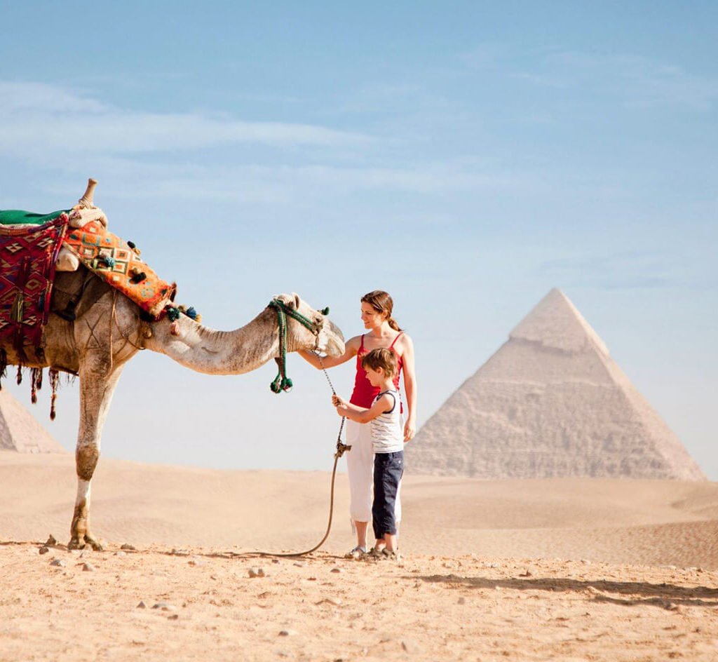 Wonderful-picture-of-a-little-boy-and-his-mother-with-a-camel-in-front-of-the-pyramids