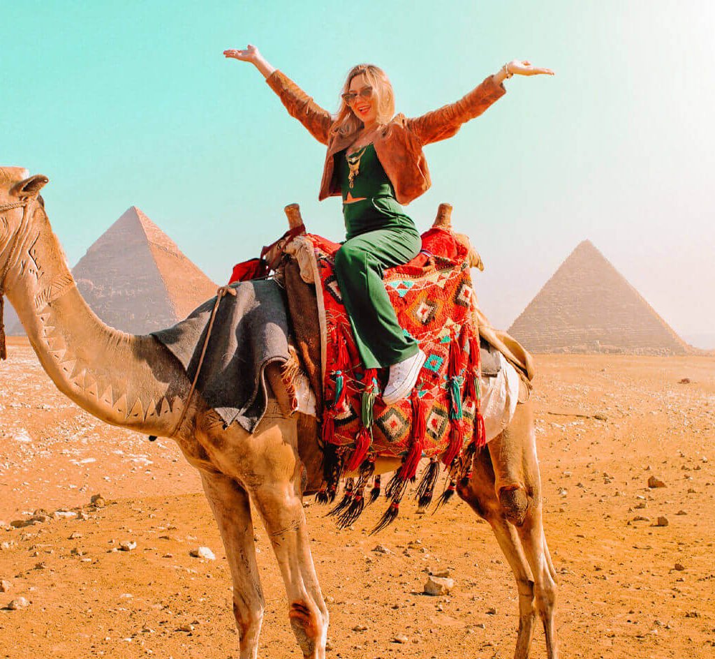 a-wonderful-shot-of-a-girl-on-the-camel-in-front-of-the-pyramids